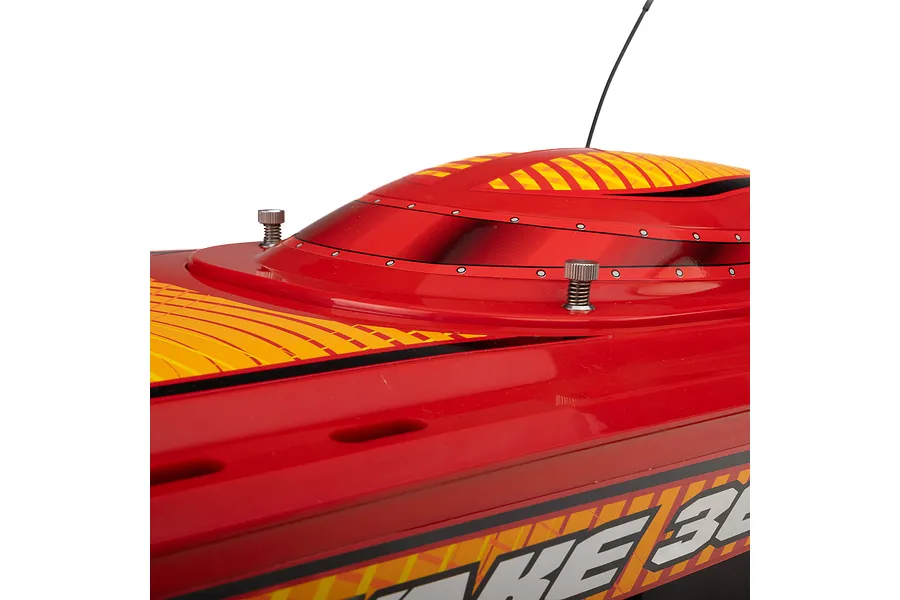 Close-up of the red and yellow deck and canopy of a Pro Boat Sonicwake V3 RC speed boat against a white background.