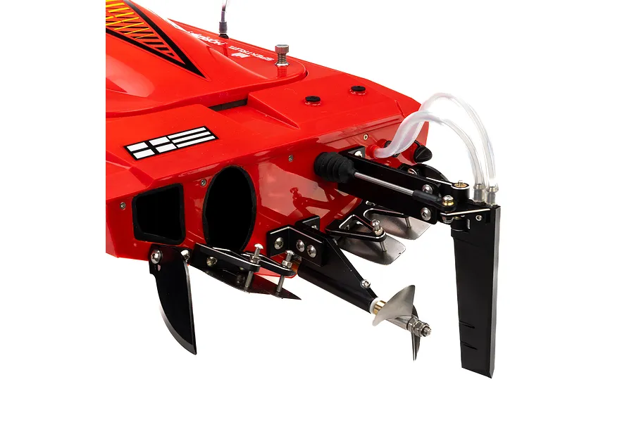 Close-up of the rear transom and hardware of a red Pro Boat Sonicwake V3 RC speed boat, showing the rudder, propeller, and trim tabs.
