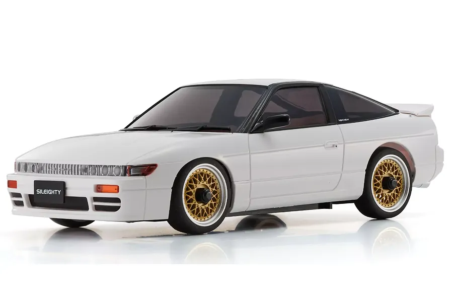 Kyosho Mini-Z MA-020 Nissan Sileighty RC drift car in white with gold mesh wheels, shown from a front three-quarter angle on a white background.