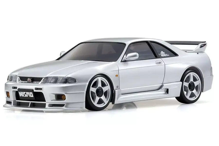 A studio shot of a silver Kyosho Mini-Z Nissan Skyline GT-R NISMO R33 RC drift car on a white background.