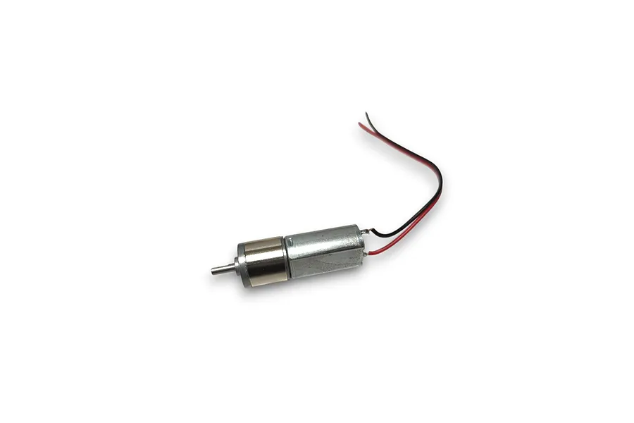 A small brushed DC motor with a metal gearbox and red and black wires attached, isolated on a white background.
