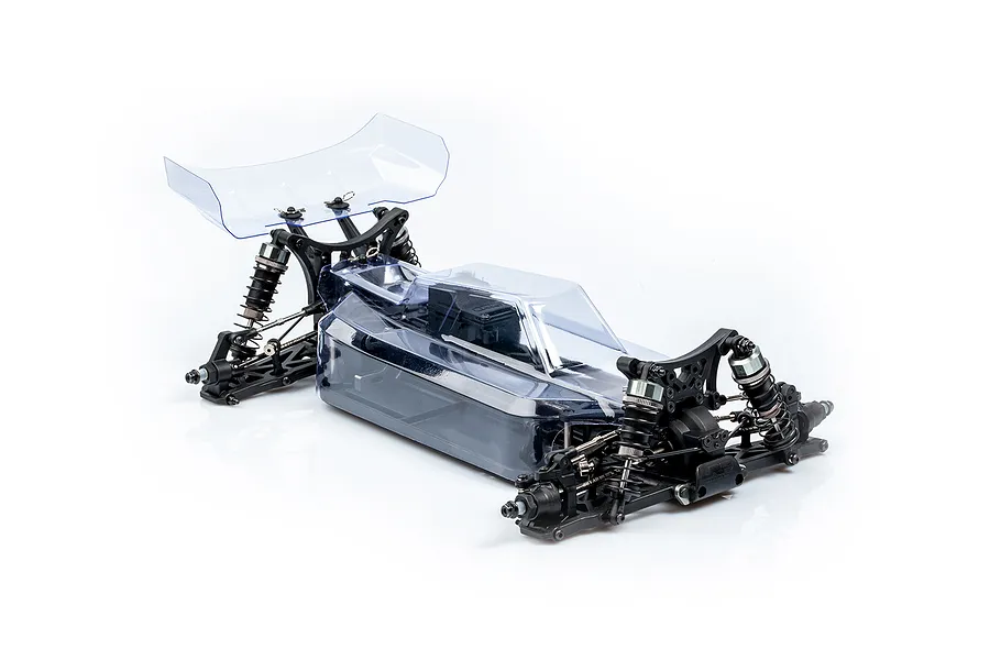 A 1/10 scale LRP Antix S10 Blast BX3 RC buggy chassis with a clear, unpainted polycarbonate body shell and rear wing, shown on a white background.