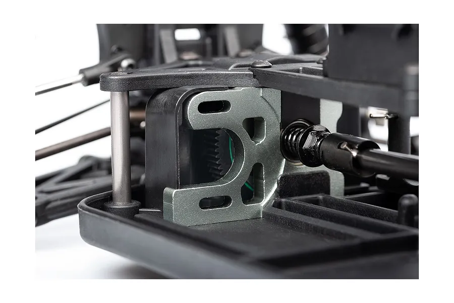 Close-up of the motor mount and drivetrain area on an LRP S10 Blast RC buggy chassis.