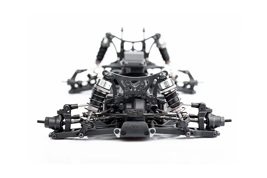 Front view of an LRP Antix S10 Blast BX3 RC buggy chassis showing suspension, shocks, and steering components on a white background.