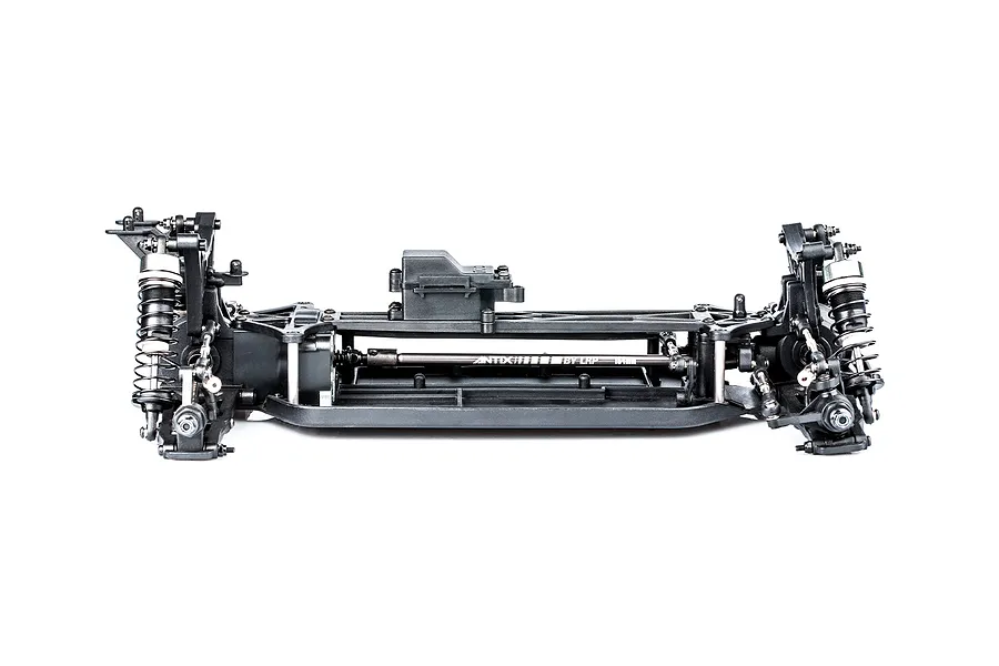 Side view of an LRP Antix S10 Blast BX3 RC buggy chassis, showing the black plastic frame, suspension components, and central driveshaft on a white background.