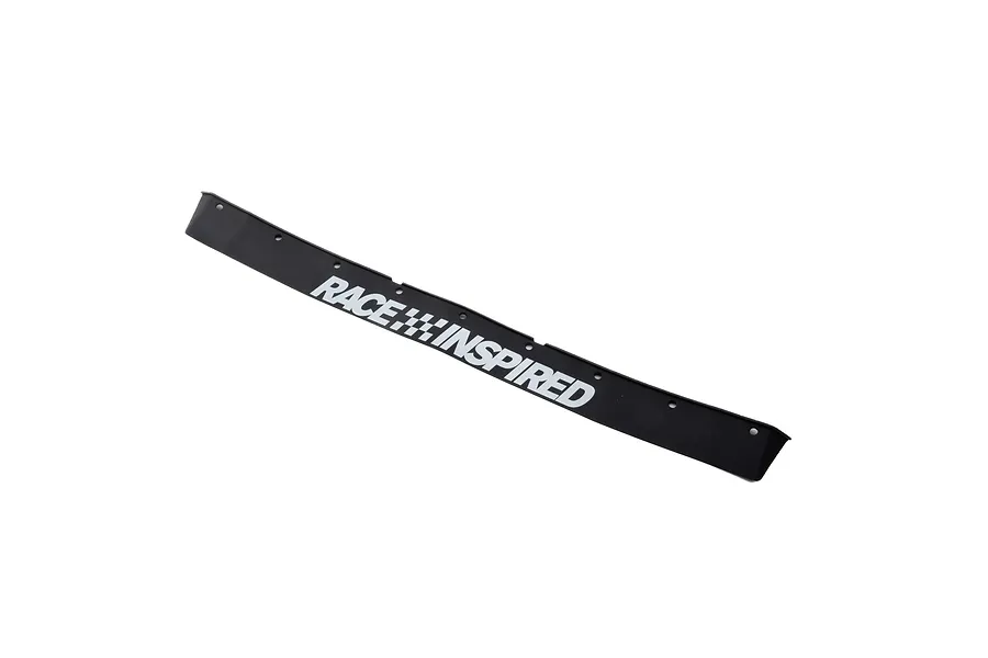 A black rubber front bumper lower valance for an RC car, featuring the white text RACE INSPIRED with a checkered flag icon.