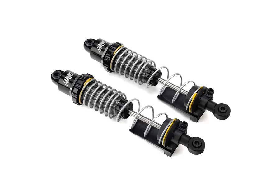Two Pro-Line PowerStroke black aluminium RC shock absorbers with silver springs and yellow accents, shown against a white background.