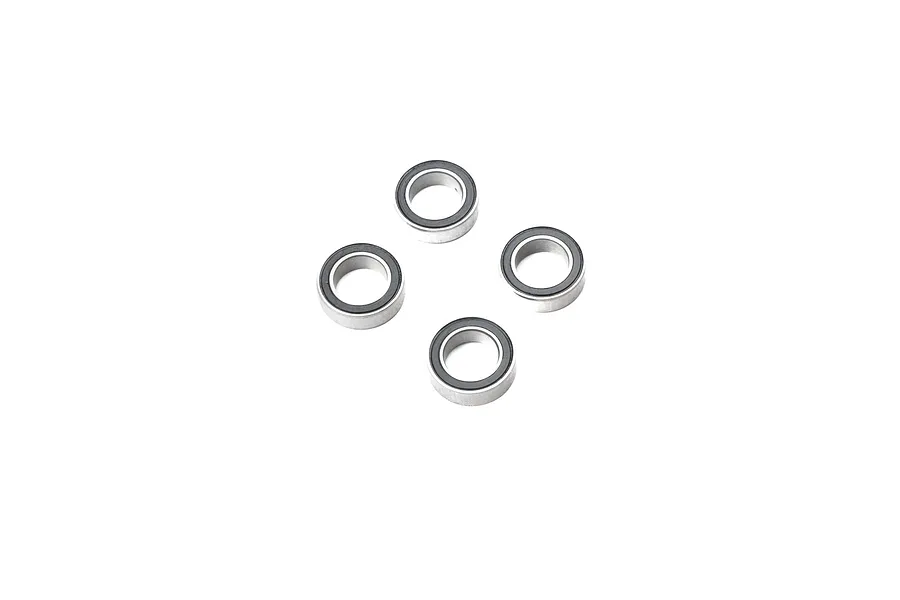 Four small metal ball bearings with black rubber seals arranged in a diamond pattern on a white background.