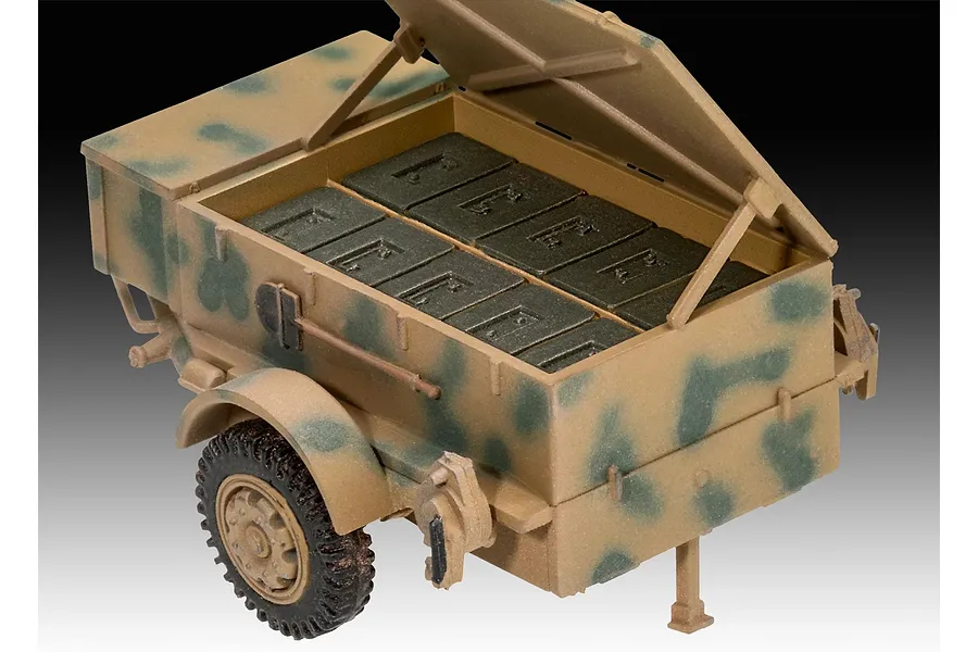 A 1/72 scale plastic model of a German Sd.Ah58 ammunition trailer with a camouflage paint scheme and open lid showing ammunition crates.