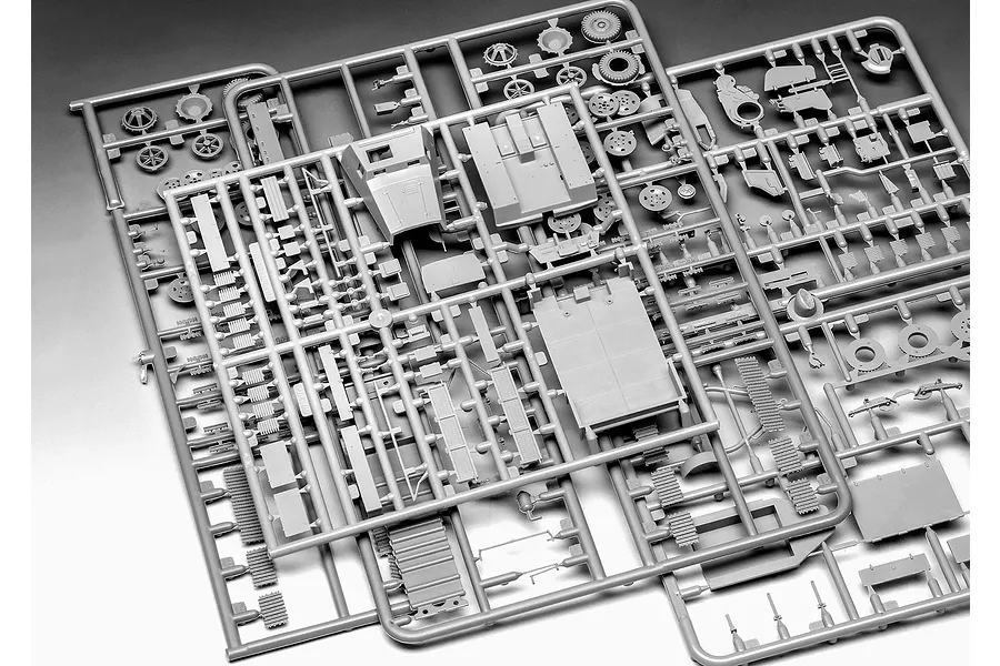 Grey plastic model kit sprues containing various vehicle parts for a 1/72 scale military model.