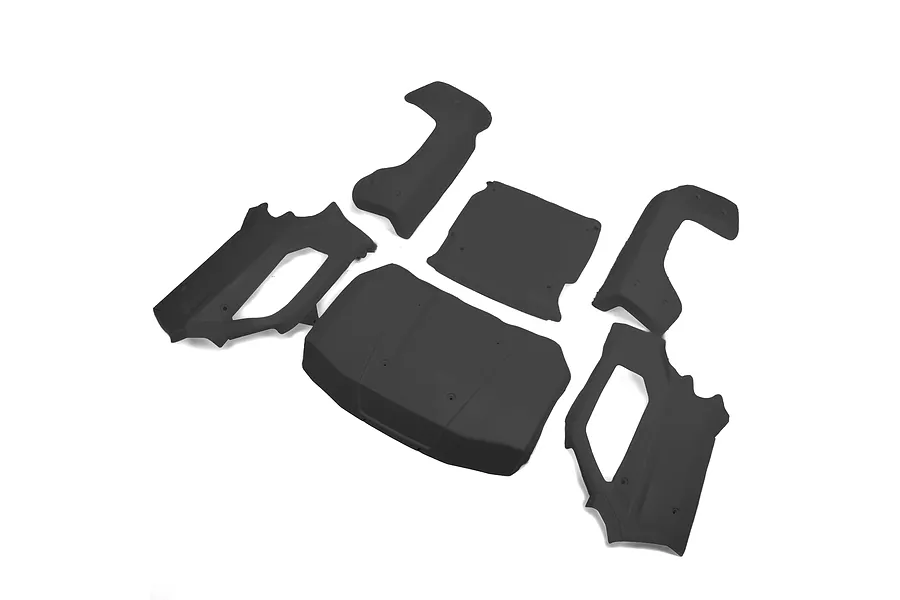 A set of five matte black RC car body panels arranged on a white background.