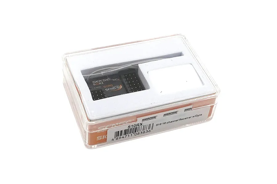 Sense Innovations S10RX 10-channel receiver with gyro inside its clear plastic retail storage case.