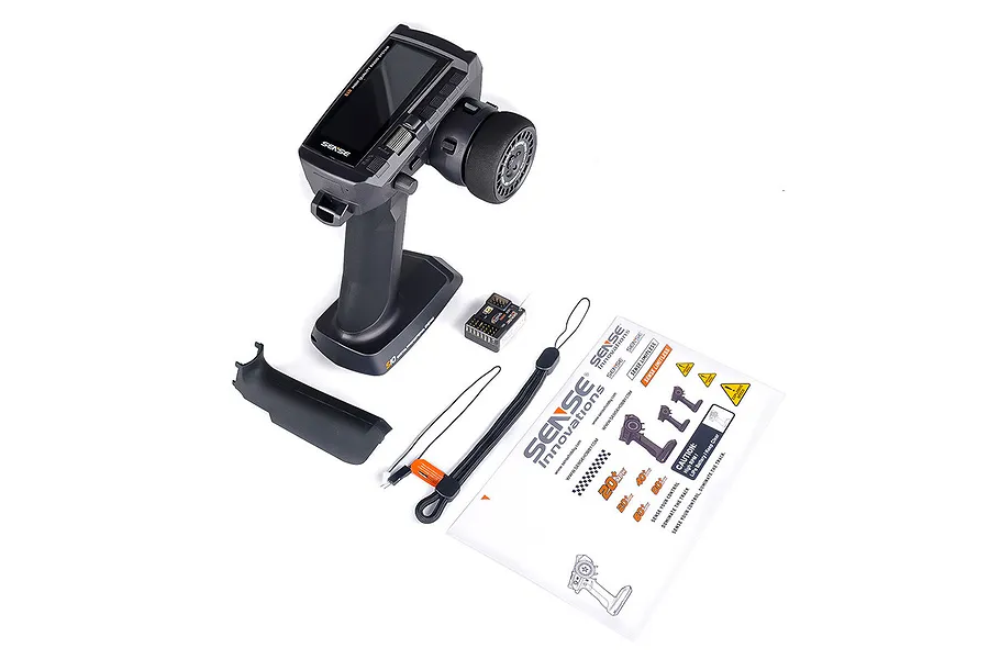 Sense Innovations S10 10-channel RC transmitter, receiver, lanyard, and manual on a white background.