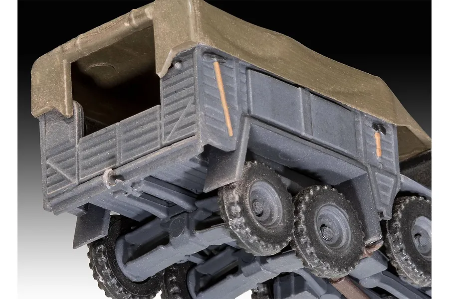 Close-up of the rear cargo bed and wheels of a 1/76 scale Krupp Protze KFZ 69 plastic model kit, showing grey plastic body and olive green canvas cover.
