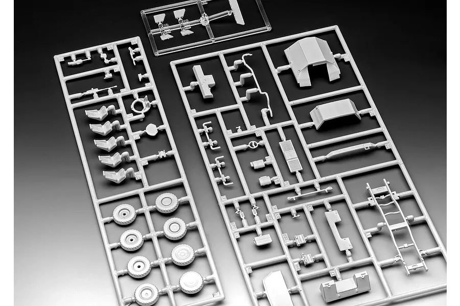 Plastic model kit sprues for a 1/72 scale ATF Dingo 1 military vehicle, featuring grey plastic parts on frames against a dark background.