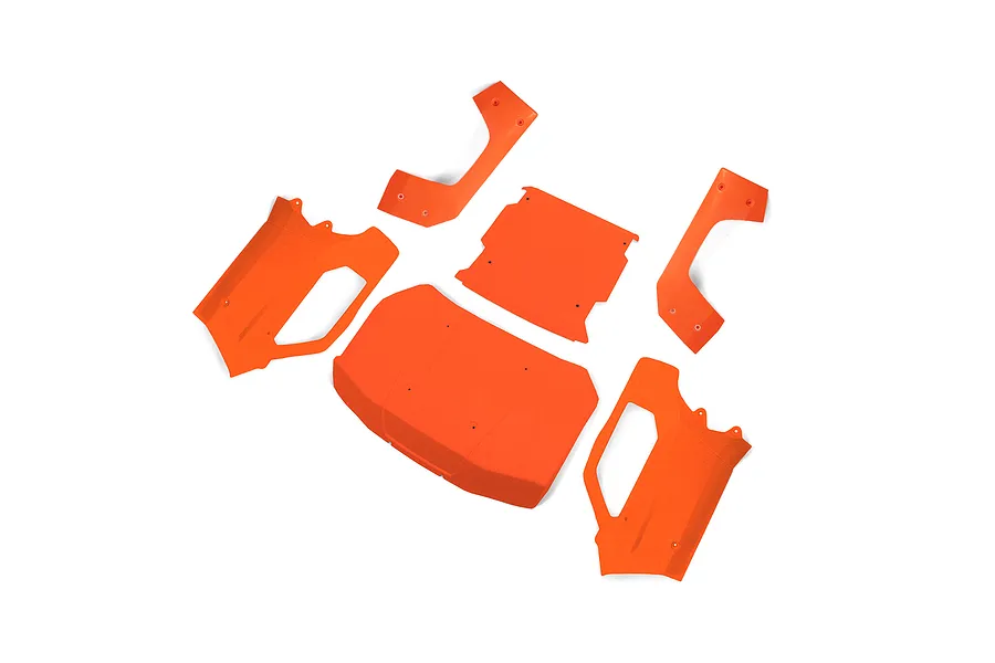 A set of fluorescent orange RC car body panels laid out on a white background.