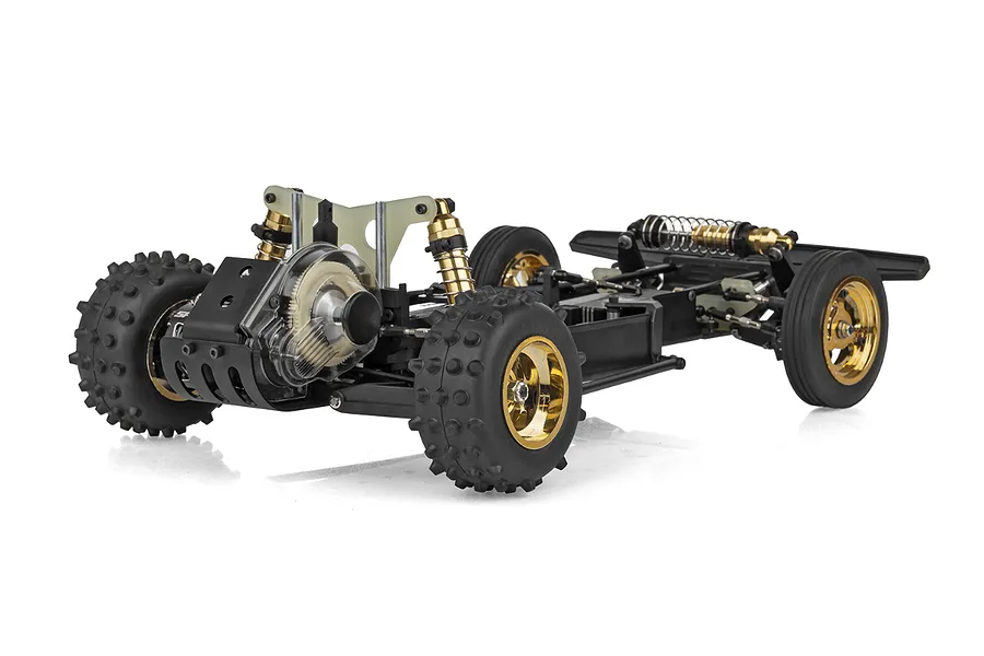 Rear three-quarter view of a Team Associated RC10 Ultra Fox RC buggy chassis kit featuring gold-anodized shocks and wheels on a white background.