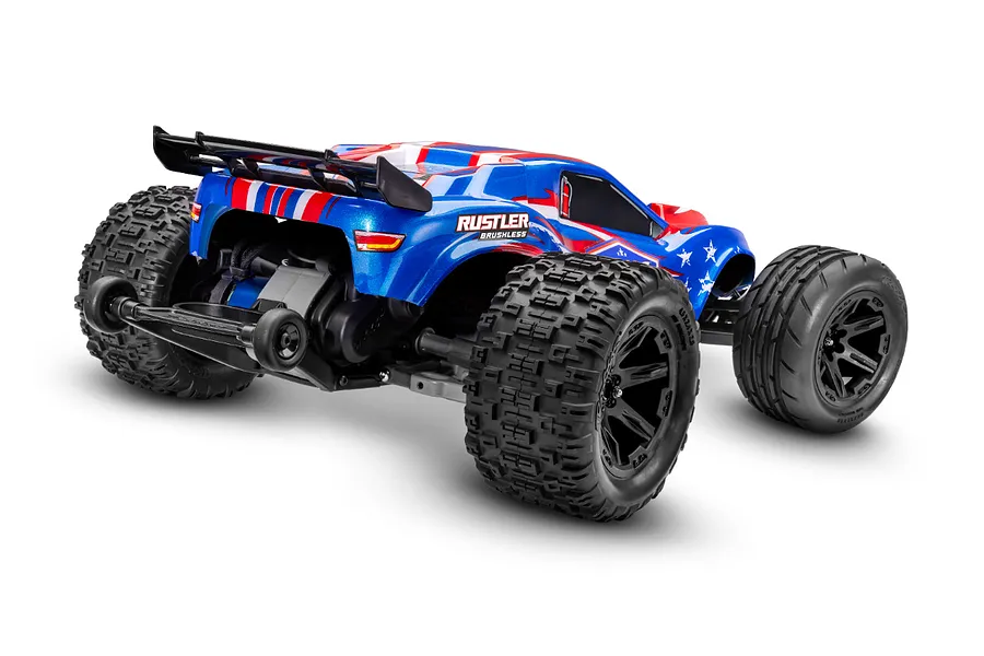 Rear three-quarter view of a blue, red, and white Traxxas Rustler VXL RC stadium truck with black off-road tires and a rear wheelie bar.
