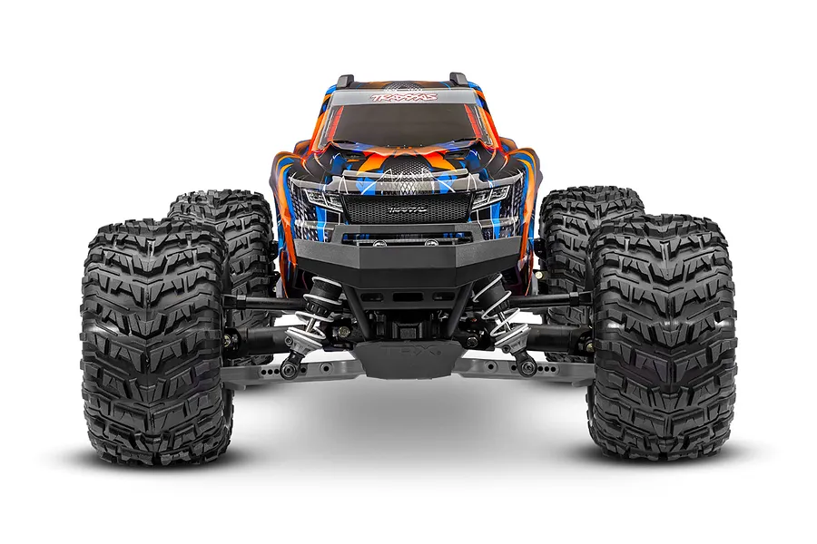 Front view of a Traxxas Stampede 4X4 RC monster truck with a blue and orange patterned body, large off-road tires, and a black front bumper.