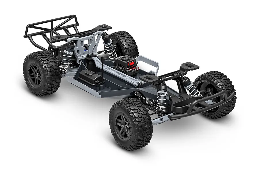 A studio shot of a Traxxas Slash 2WD RC short course truck chassis without the body shell, showing the suspension, wheels, and electronic components.