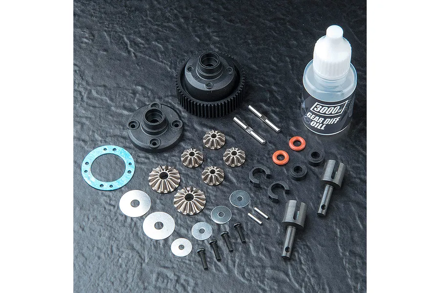 MST 60T differential kit components including gear housing, internal bevel gears, outdrives, screws, washers, and a bottle of 3000# gear diff oil.