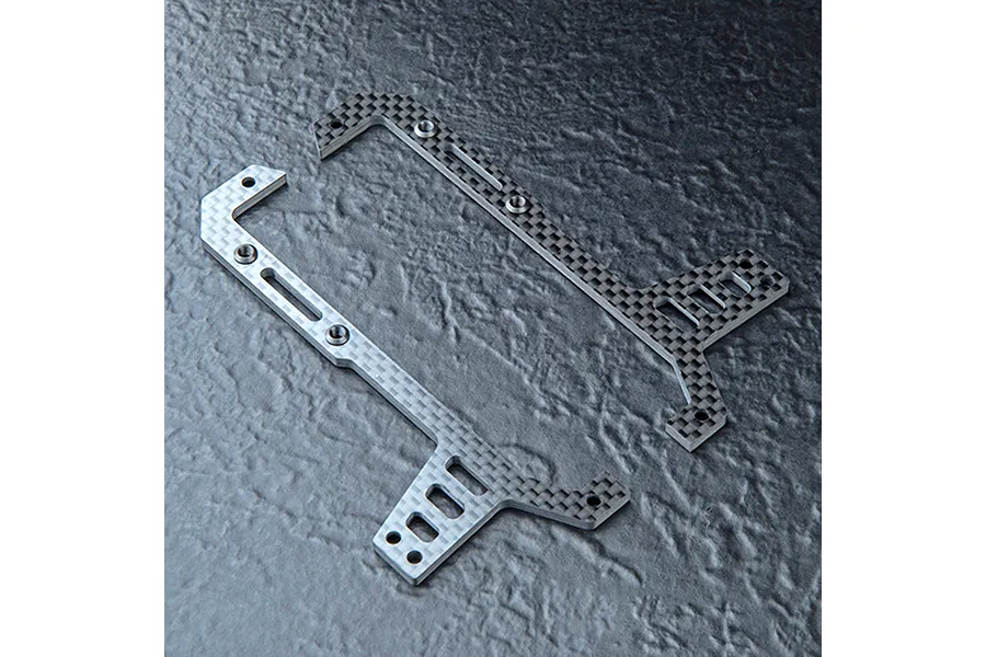 Two carbon fiber front upper deck plates for an RC car chassis, featuring a checkered weave pattern and multiple mounting holes.