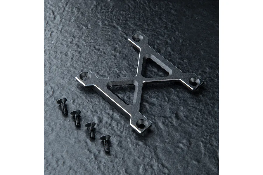 MST black aluminium X-shaped suspension arm mount brace with four matching black screws on a textured dark surface.