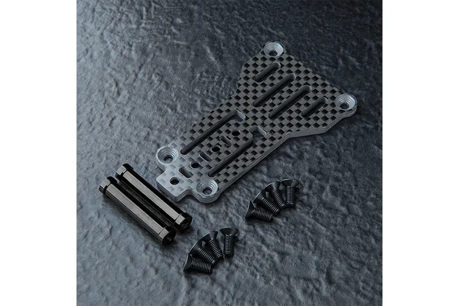 MST carbon fiber rear link plate with two black metal standoffs and eight small black screws on a textured dark surface.