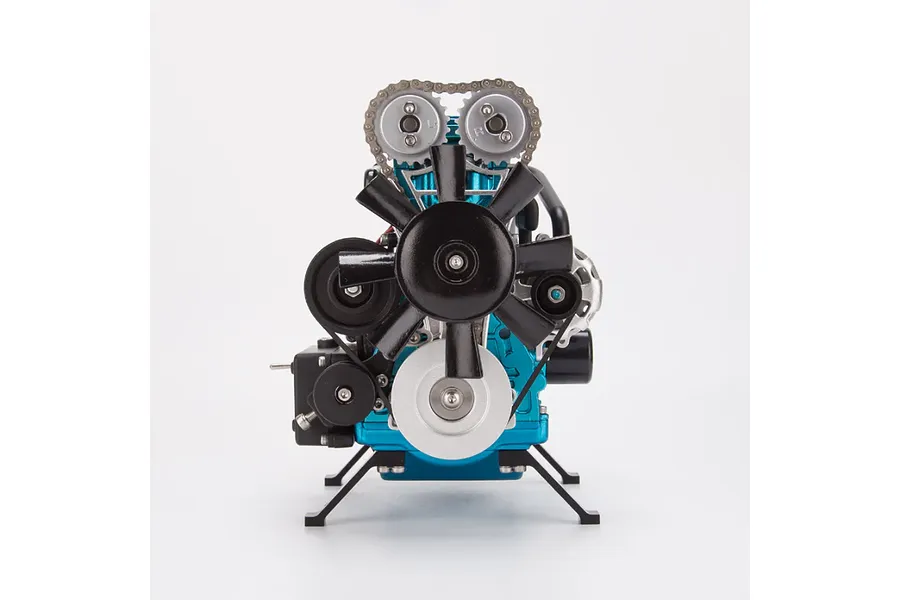 Front view of the Teching DM111 turbocharged four-cylinder engine model kit featuring blue and black metal components on a white background.