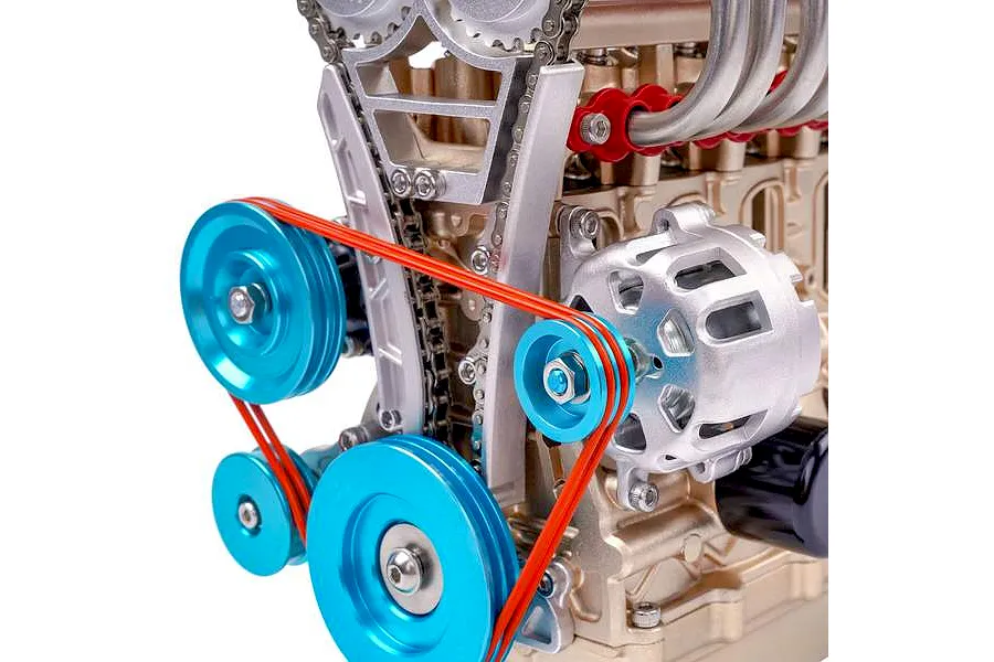 Close-up of a Teching DM113 four-cylinder engine model showing blue pulleys, red drive belts, and metallic engine components.