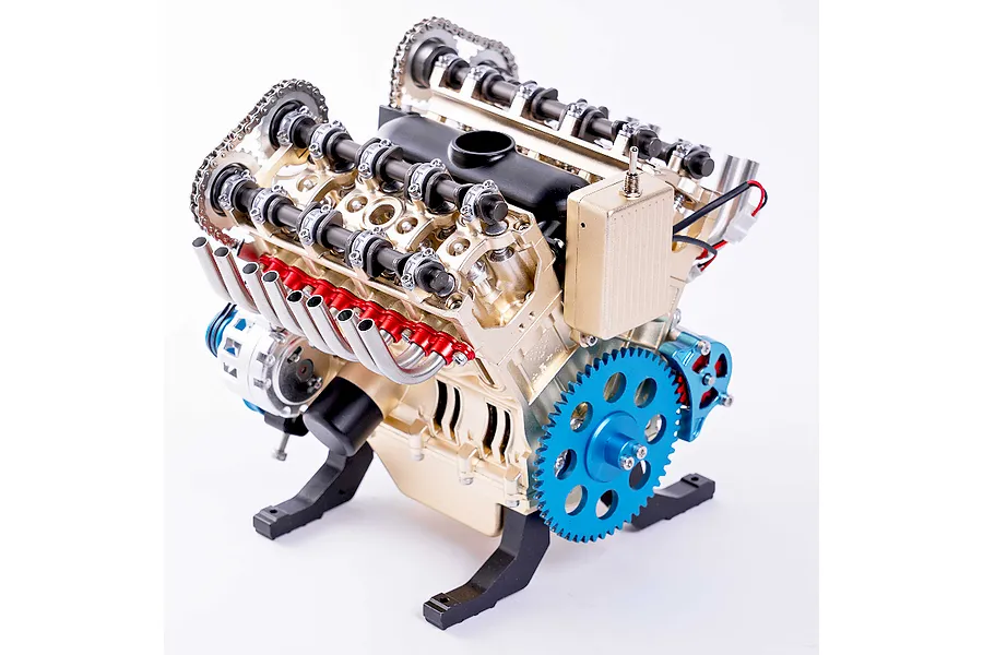 A detailed metal V8 engine model kit by Teching, featuring gold, blue, and red components on a white background.