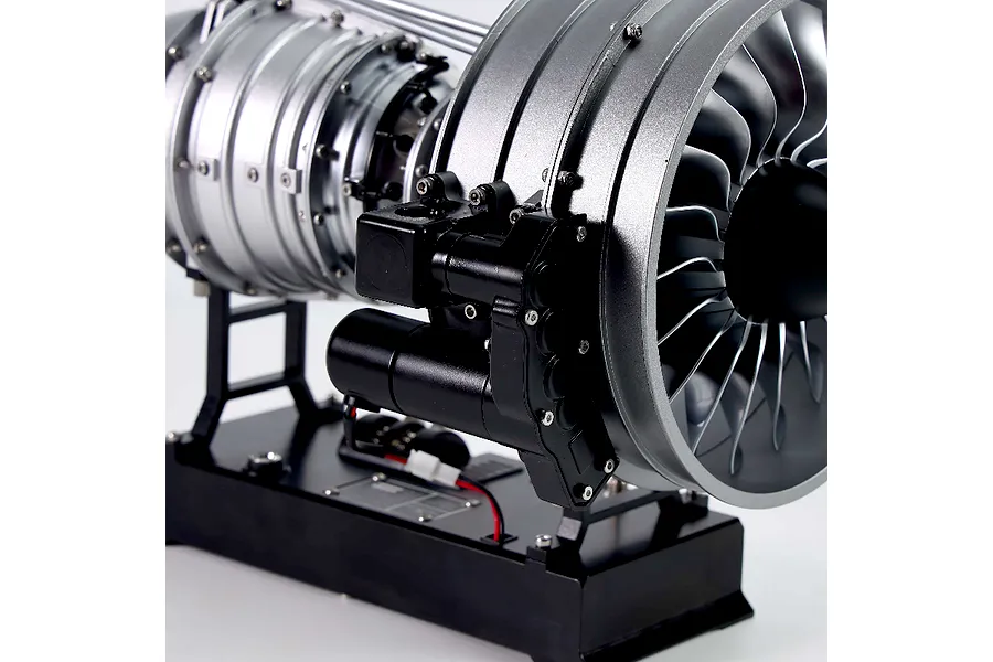 Close-up of the Teching DM121 civil turbofan engine model kit showing the fan blades, motor assembly, and base.