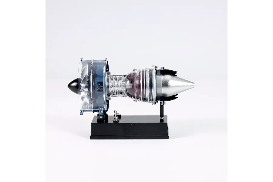 A Teching DM122 mini turbofan engine model kit displayed on a black stand against a white background.