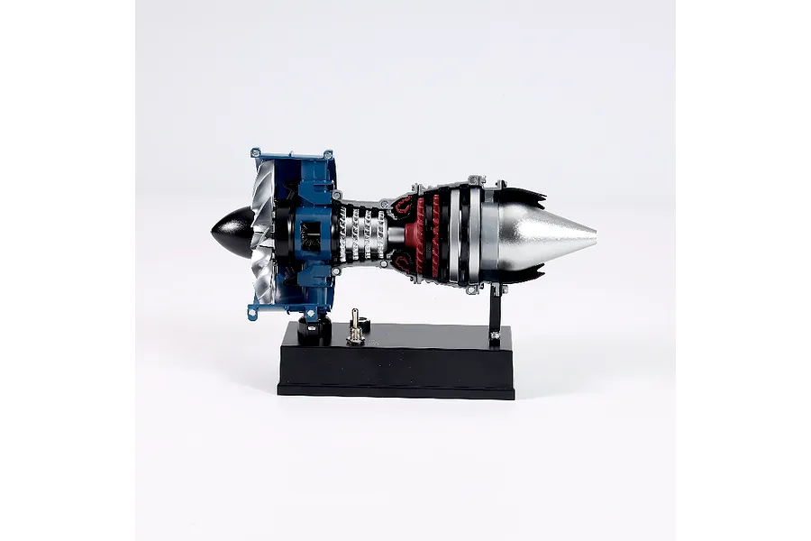 A side view of the Teching DM122 mini turbofan engine model kit mounted on a black display base against a white background.