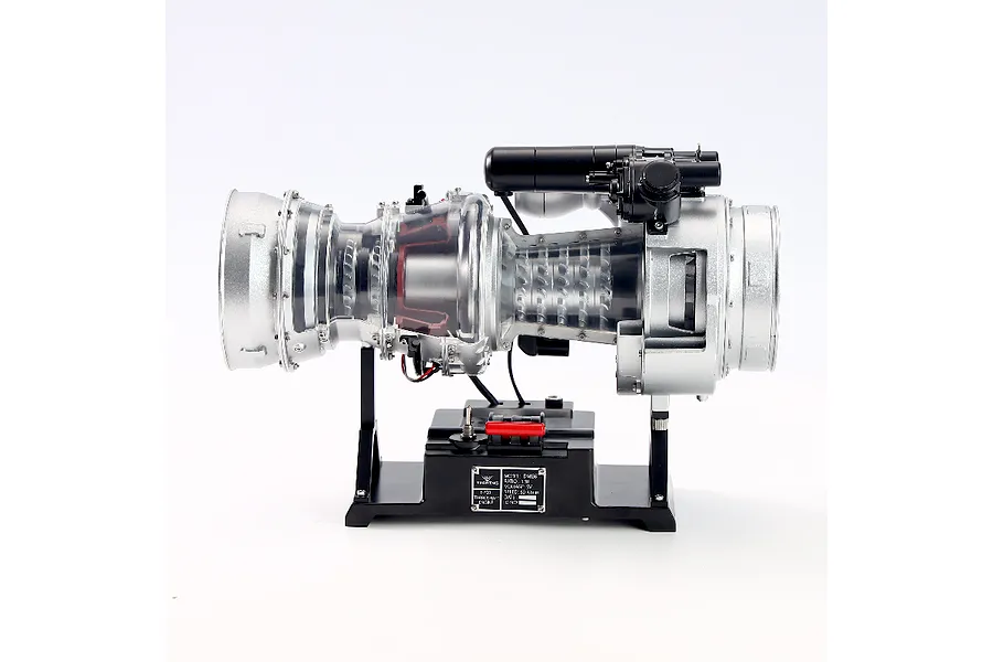 Side view of the Teching DM136 T-700 turboshaft engine model kit mounted on a black display base against a white background.