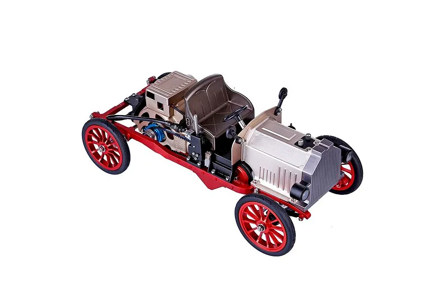 A high-angle studio shot of the Teching DM227 classic car metal model kit, featuring a red chassis, silver engine components, and spoked red wheels.