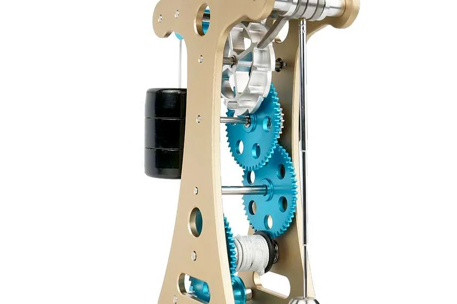Close-up of the Teching DM335 Galileo Pendulum Clock metal model kit showing the internal gears, frame, and pendulum mechanism.