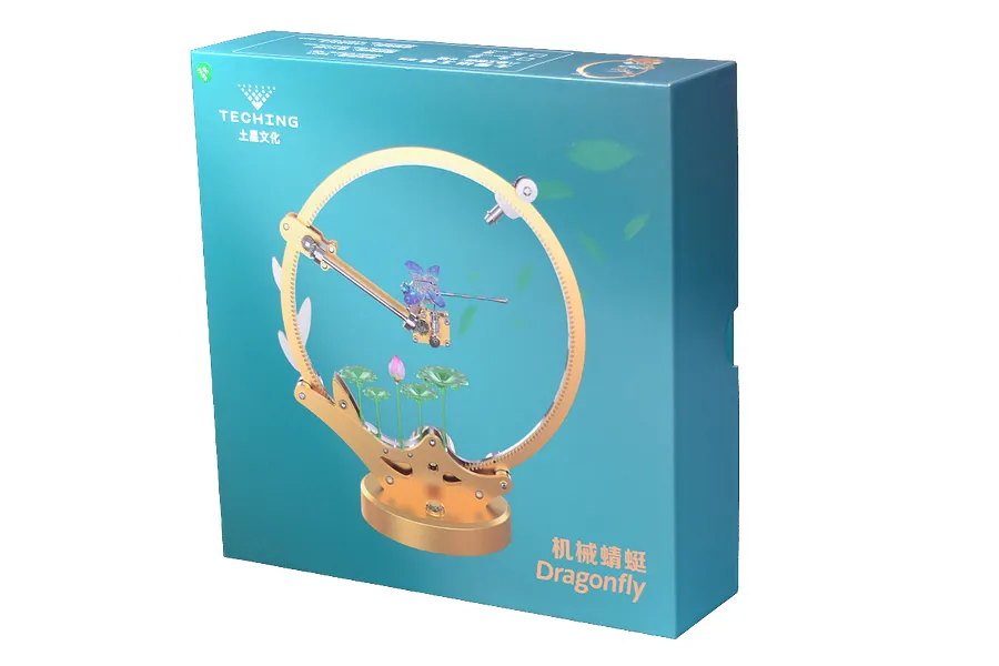 Teching DM336 Dragonfly metal model kit packaging box showing a finished mechanical dragonfly model on a circular stand.