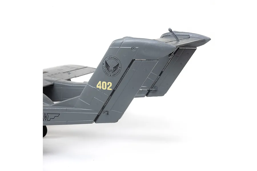 Close-up of the grey tail section of an E-Flite Micro OV-10 Bronco RC plane, featuring the number 402 and a Philippine Air Force emblem.