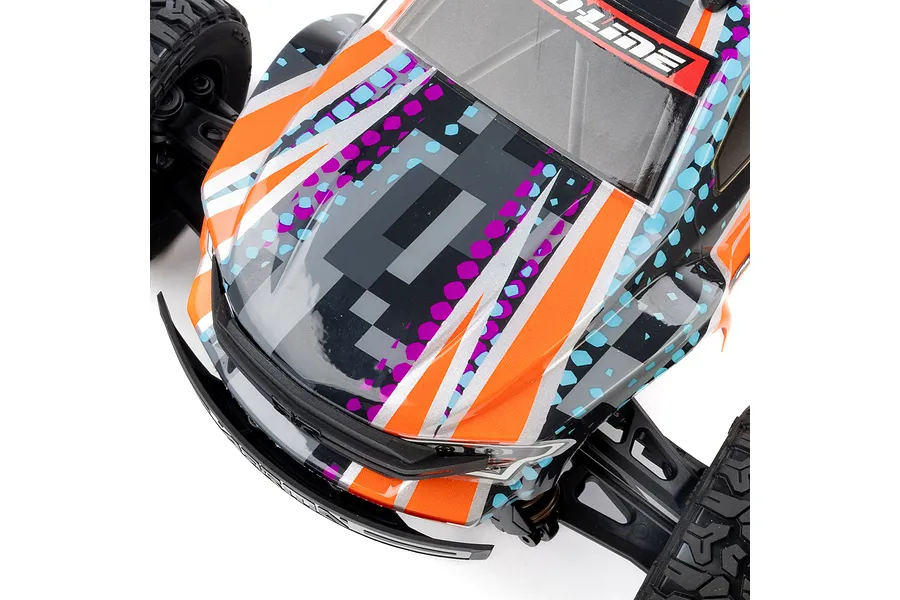 A close-up, high-angle view of a Pro-Line 1/16 Brute RC truck body shell featuring a digital camo pattern in orange, purple, black, and light blue.