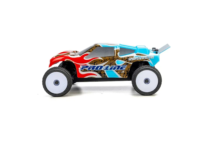 Side view of a 1/28 scale RC truck with a blue, red, and gold Crowd Pleazer body shell mounted on a chassis with white wheels.