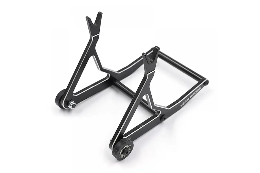 A black Yeah Racing aluminium RC car stand with silver chamfered edges and small wheels, viewed from a high angle against a white background.