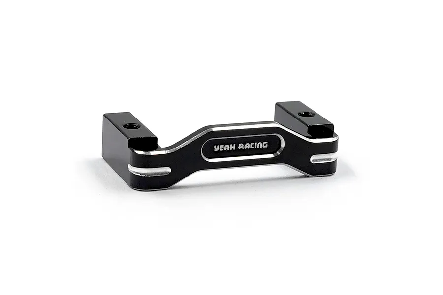 A black anodized aluminium servo mount by Yeah Racing with silver chamfered edges and the brand name engraved on the front.