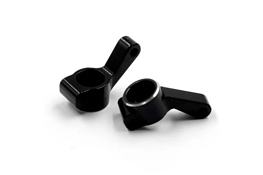 Two black anodized aluminium RC rear hub carriers shown from a high angle against a white background.
