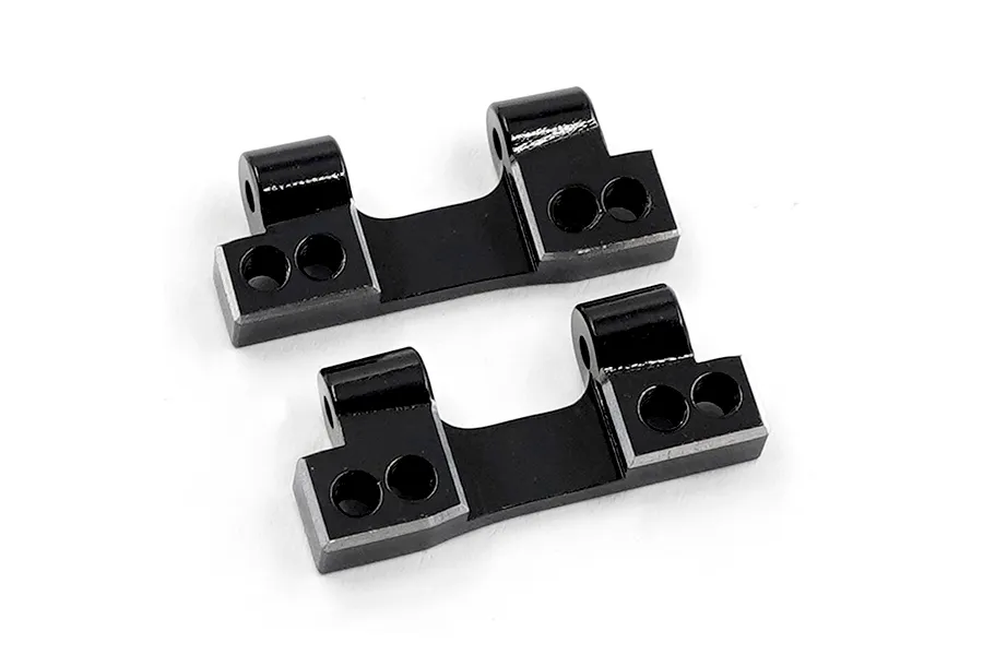 Two black aluminium RC rear lower arm mounts from Yeah Racing, shown from an angled perspective on a white background.