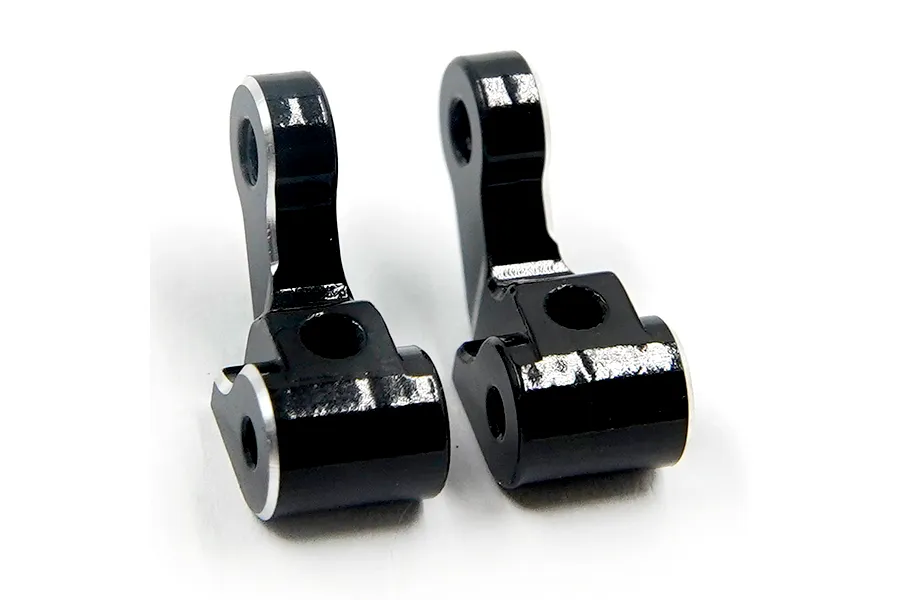 Two black anodized aluminium front steering hubs for RC cars, featuring silver chamfered edges.