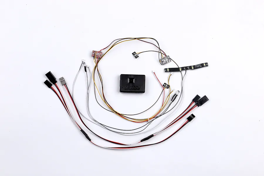 Killerbody 12LED accent light set with a central black control box, various LED modules, and wiring harnesses laid out on a white background.