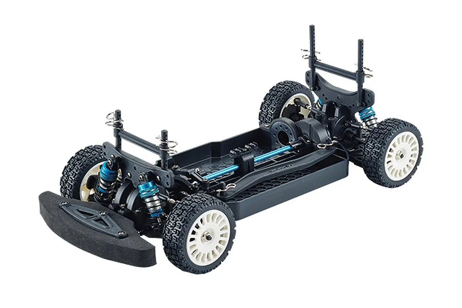 A studio shot of the Killerbody Mars KR10 1/10 scale RC rally car chassis kit, showing the black plastic frame, blue shocks, and white rally wheels.