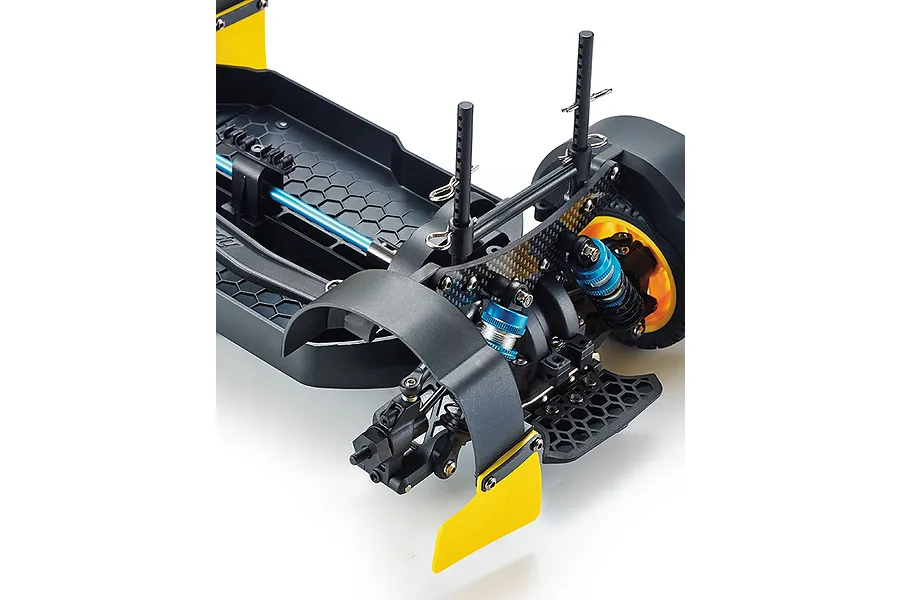 Close-up of the rear chassis assembly of a Killerbody Mars KR10 RC rally car, showing suspension, carbon fiber shock tower, and yellow mud flaps.