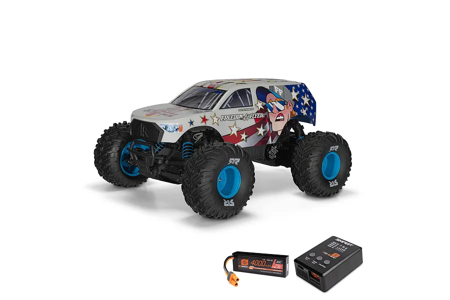 ARRMA Freedom Flyer RC monster truck with patriotic graphics, shown with a Spektrum Smart LiPo battery and S100 charger on a white background.